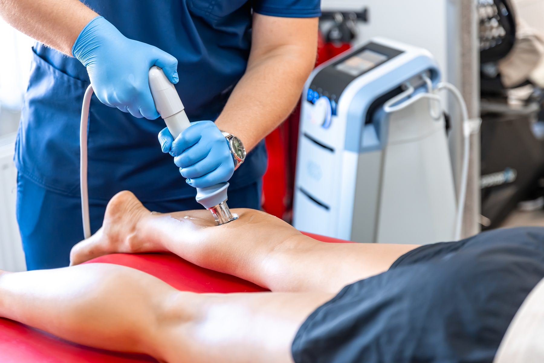 Athlete getting foot treatment for sports injury by podiatrist