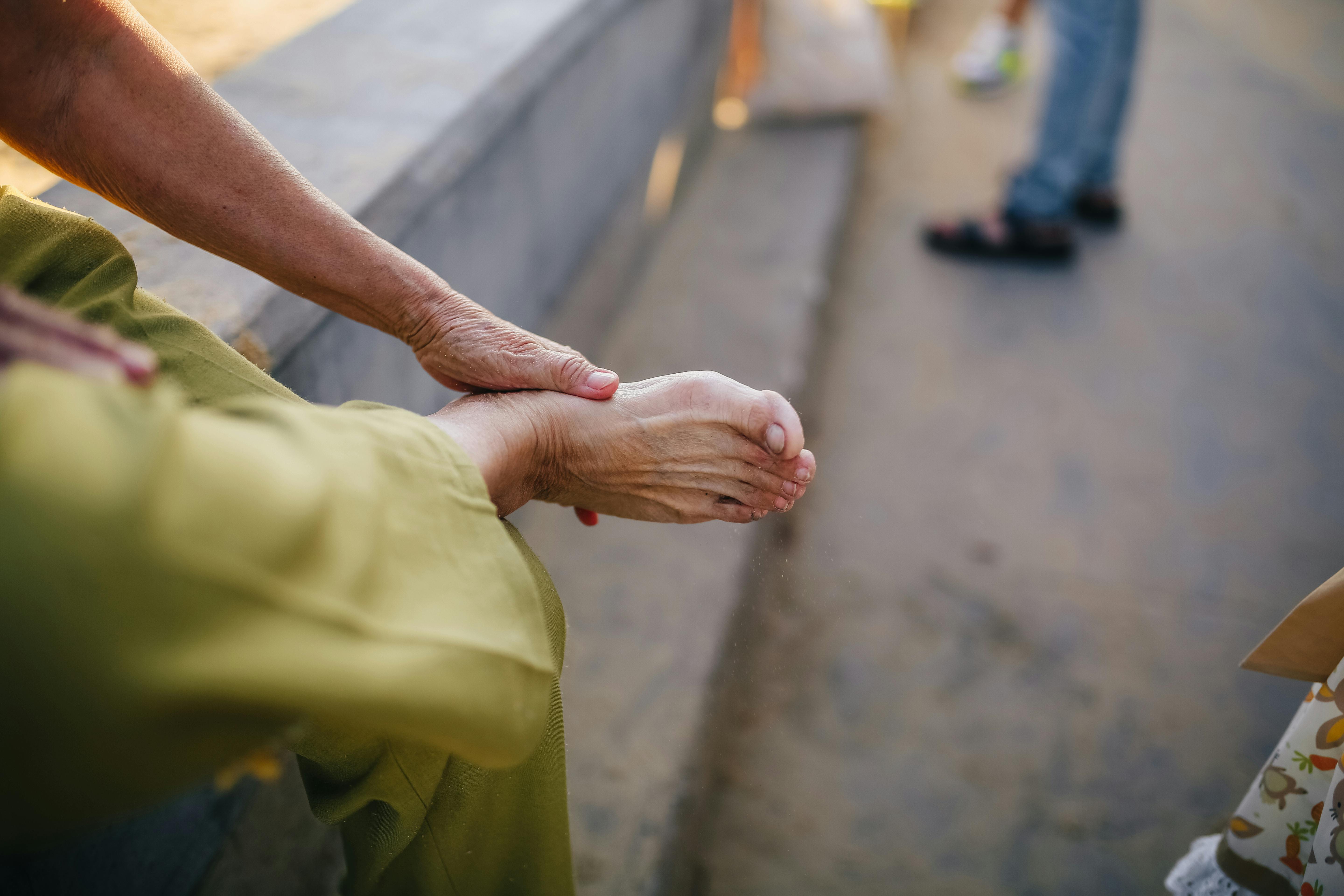 Man holding heel in pain