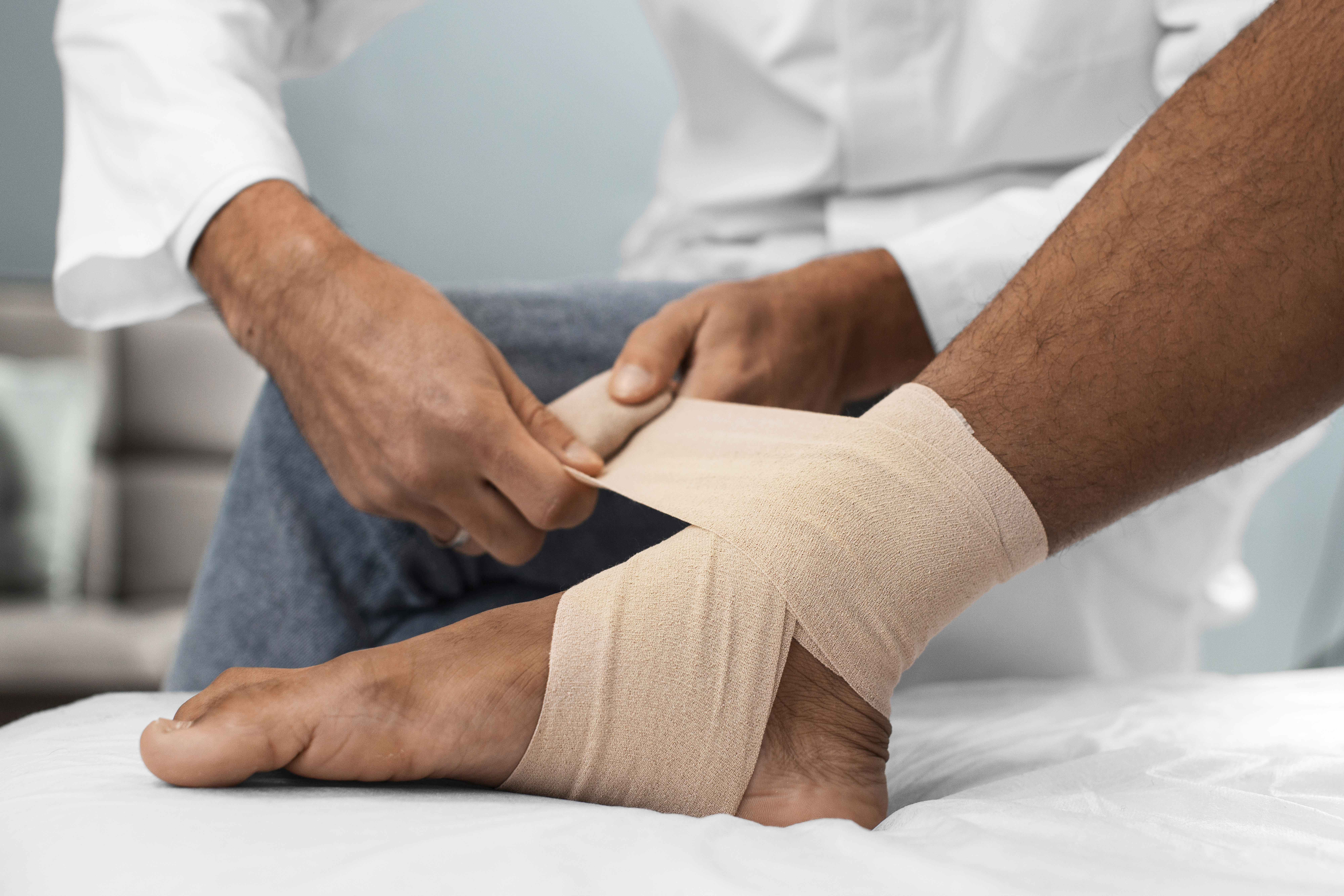 Doctor giving Ankle Sprain Treatment